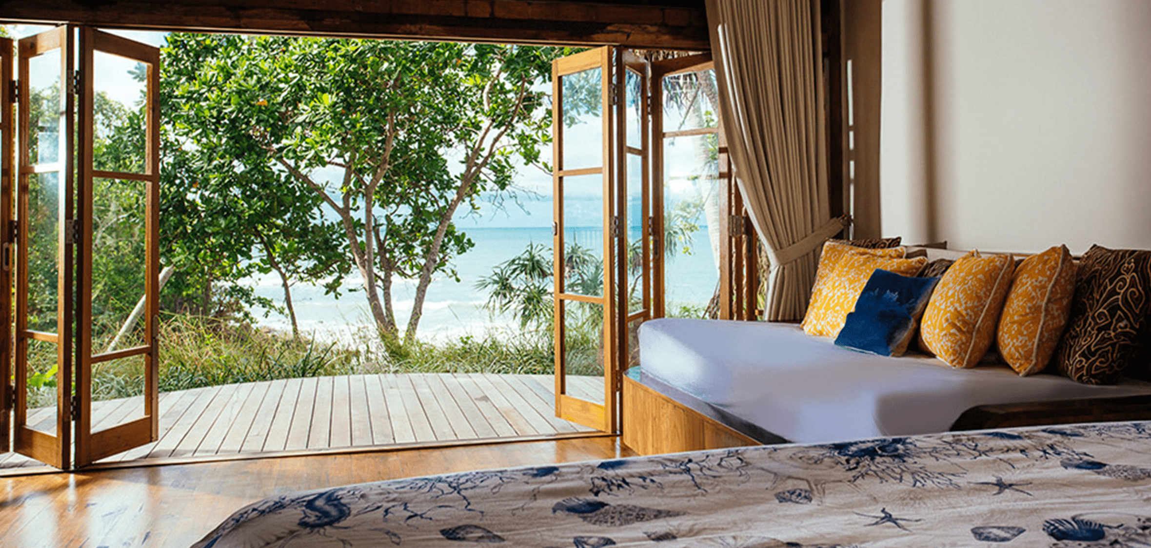 a Bali villa bedroom with view of the ocean