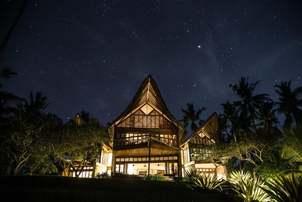 Bali villa at night with starry sky
